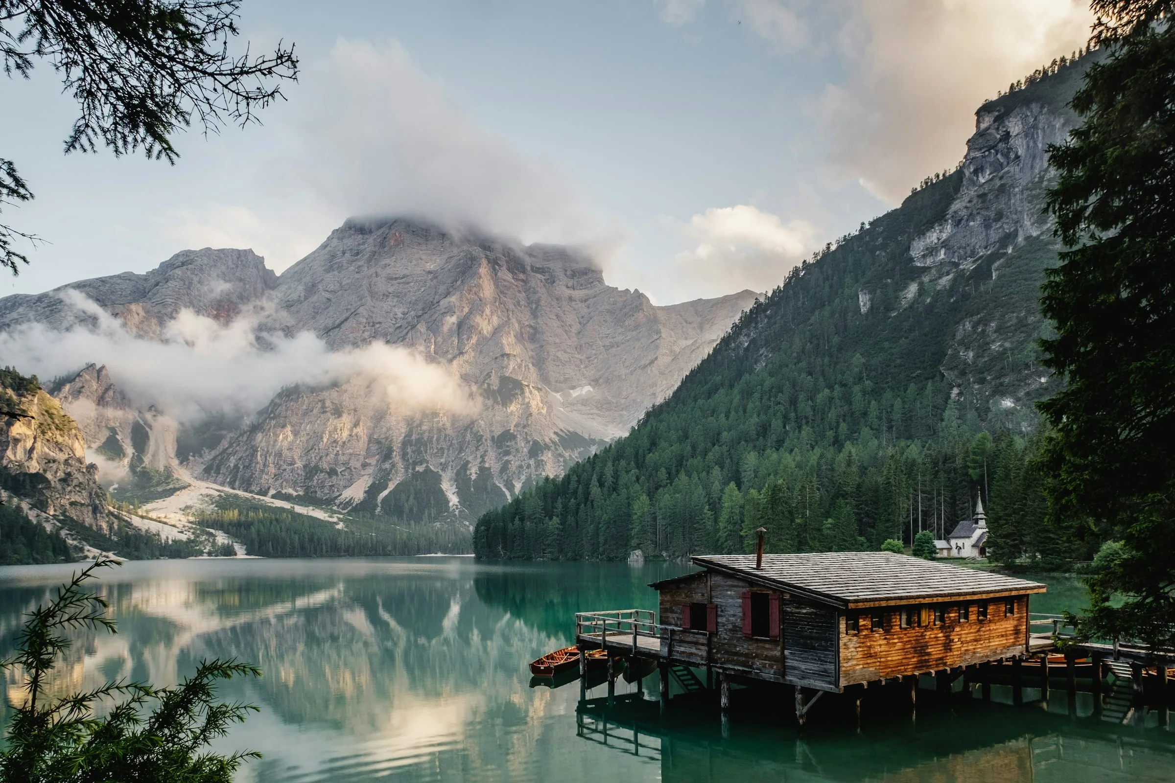 Alpine lake surrounded by forest and mountains